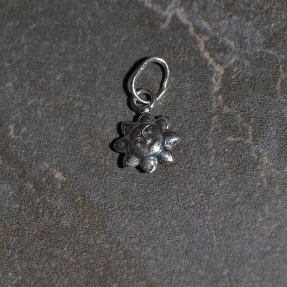 Sterling silver double sided sun charm